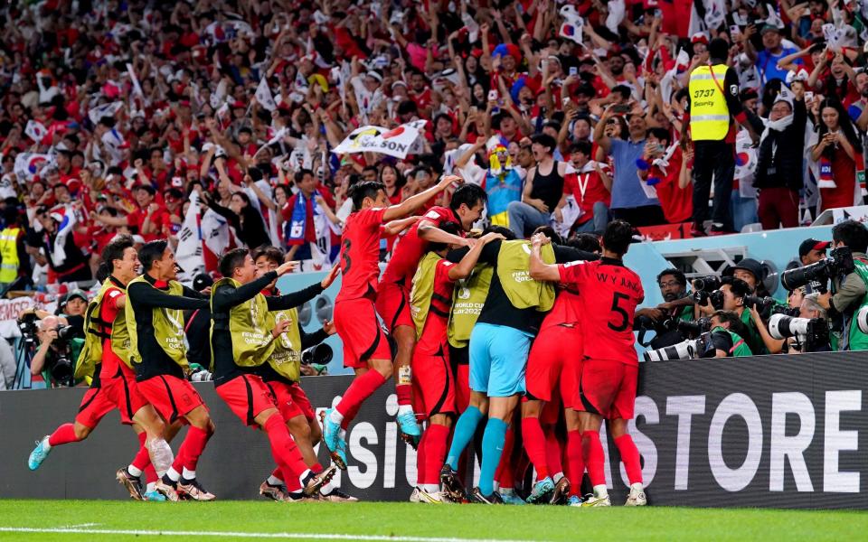 South Korea players celebrate after Hwang Hee-chan scores their side's second goal - PA