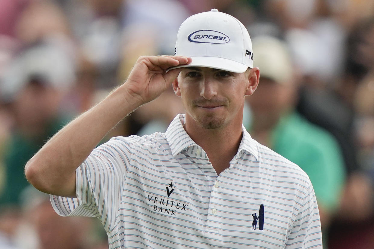 Sam Bennett tips his cap on the 18th hole during the second round of the Masters at Augusta National Golf Club on Friday, in Augusta, Ga. The amateur is second place in the clubhouse after two rounds. (AP Photo/Charlie Riedel)