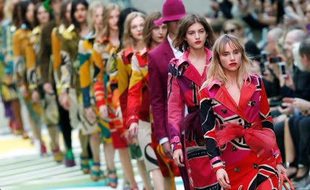 Models present creations from the Burberry Prorsum Spring/Summer 2015 collection during London Fashion Week September 15, 2014. REUTERS/Suzanne Plunkett