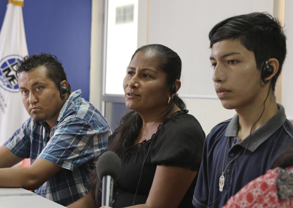 Deported Salvadorans, from left, David Escobar Fuentes, Sandra Maria Monroy and Byron Melgar Menjivar recount their stories after they fled El Salvador due to violence and poverty and tried to reach the United States with last year's migrant caravans during his visit to La Chacra Immigration Center in San Salvador, El Salvador, Monday, April 8, 2019. (AP Photo/Salvador Melendez)