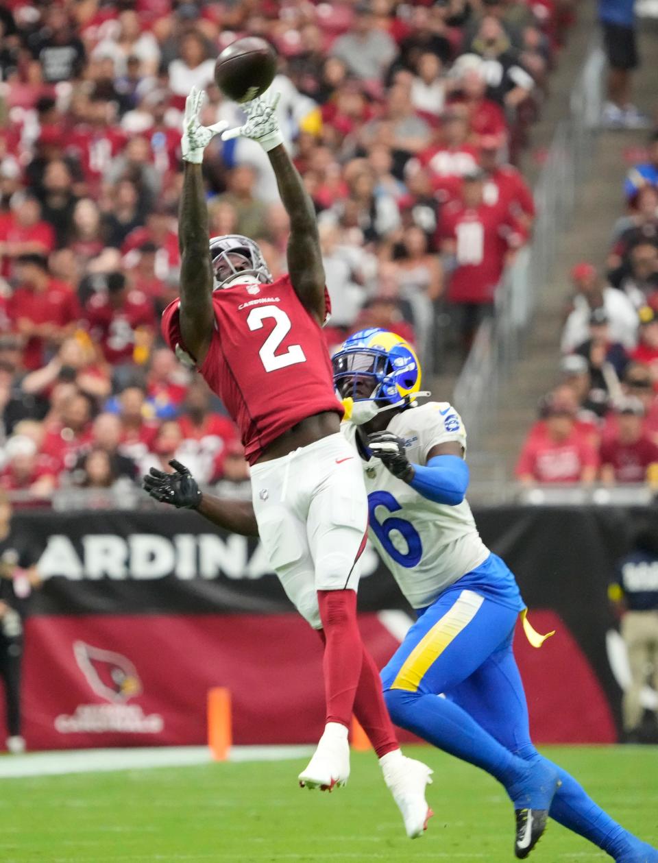 Sep 25, 2022; Glendale, Ariz., U.S.;  Arizona Cardinals wide receiver Marquise Brown (2) catches a pass against Los Angeles Rams cornerback Derion Kendrick (6) during the first quarter at State Farm Stadium.