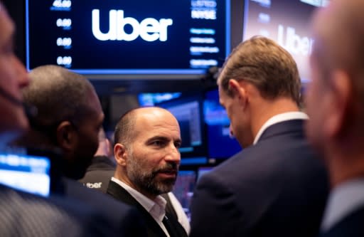 Uber CEO Dara Khosrowshahi talks to traders after the opening bell at the New York Stock Exchange where the ride-hailing giant's shares slipped in their first trading session