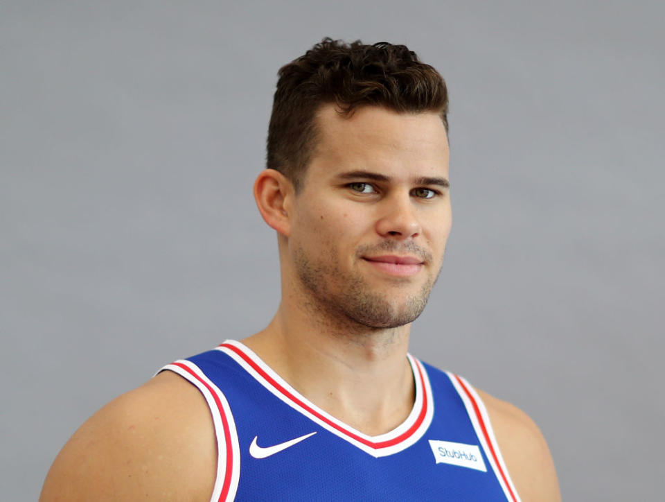 Kris Humphries wearing a basketball jersey, smiling and looking at the camera