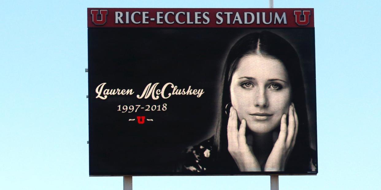 In this Nov. 10, 2018, file photo, a photograph of University of Utah student and track athlete Lauren McCluskey, who was fatally shot on campus, is projected on the video board before the start of an NCAA college football game between Oregon and Utah in Salt Lake City.
