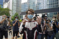 Various defendants including pro-democracy activist Figo Chan Ho-wun arrives at a court in Hong Kong, Monday, May 17, 2021. Trial starts for Jimmy Lai and nine others, accused of "incitement to knowingly take part in an unauthorized assembly" for a protest march on Oct. 1, 2019. The court has estimated 10 days for this trial. (AP Photo/Kin Cheung)