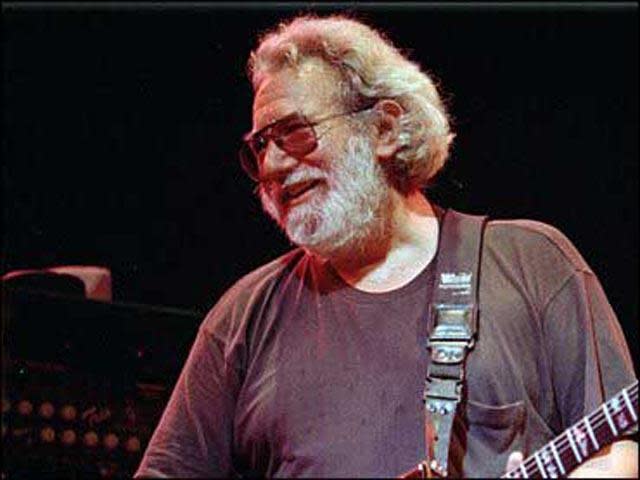 Grateful Dead lead singer Jerry Garcia performs at the Oakland Coliseum on Nov. 1, 1992. / Credit: AP