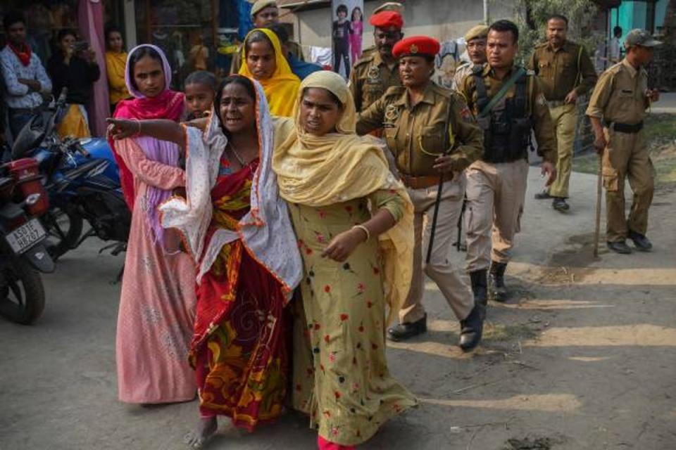 People react after police arrested their relatives allegedly involved in child marriages, during the Assam government’s statewide crackdown on child marriages, near Mayong police station in the Morigaon district of Assam on 4 February 2023 (AFP via Getty)