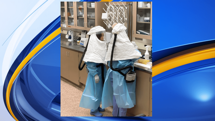 Dr. Annabel Wise and her colleague, Danielle Thompson, work in the BL3 lab with highly pathogenic avian influenza samples. (Photo Courtesy MSU)