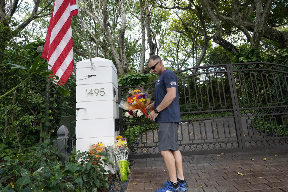 Logan Nichols vacationing from California drops off a bouquet of flowers at the home of talk radio host Rush Limbaugh, Wednesday, Feb. 17, 20121 in Palm Beach, Fla. Limbaugh, 70, died this morning of lung cancer. (AP Photo/Marta Lavandier)