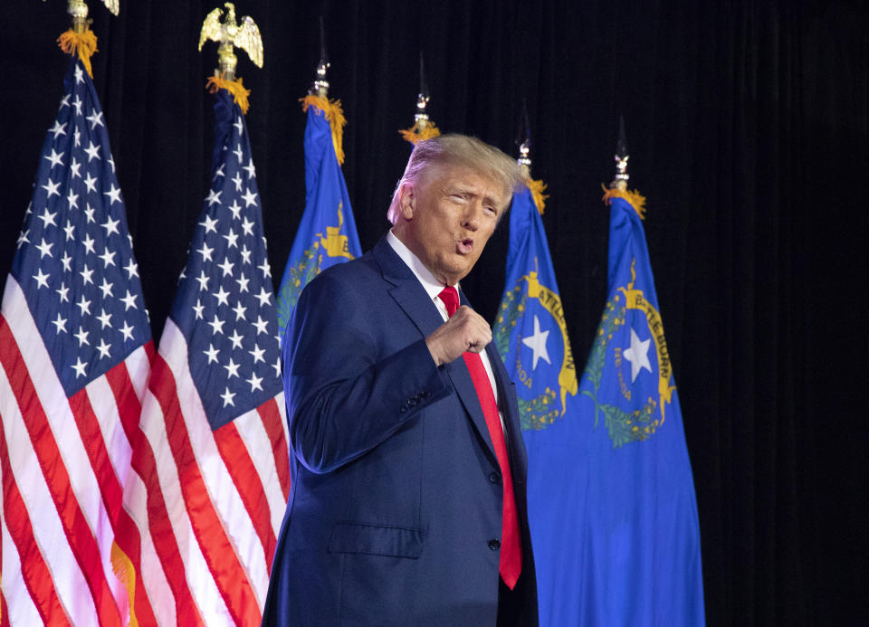 LAS VEGAS, NV - JULY 8: Donald Trump steps up to the podium and pumps his fist before speaking at the Nevada Volunteers Recruitment Event on Saturday, July 8, 2023 at Fervent Calvary Chapel Church in Las Vegas. President Trump.  (Photo by Rhonda Churchill for The Washington Post, via Getty Images)