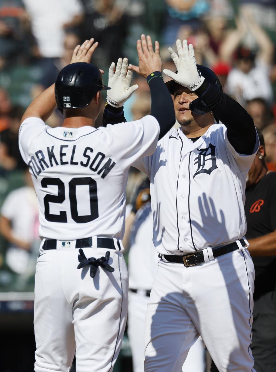 Tigers DH Miguel Cabrera celebrates with first baseman Spencer Torkelson after hitting a three-run home run against the Astros during the eighth inning at Comerica Park on Aug. 27, 2023, at Comerica Park.