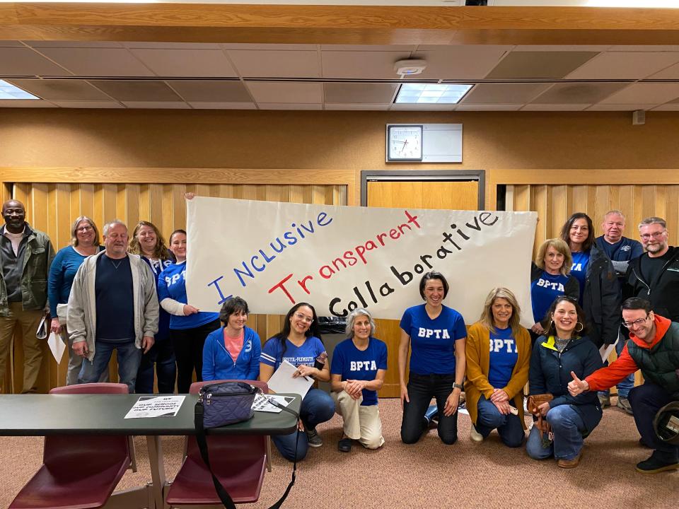 Members and supporters of the Bristol-Plymouth Teachers Association with their sign at the end of the B-P school committee meeting on Wednesday, April 3, 2024.