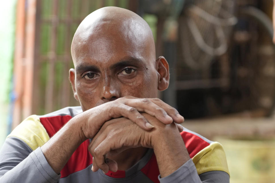 Jugnu, 35, mourns the death of his mother Munni Devi, 60, victim of a stampede, in Hathras district, Uttar Pradesh, India, Wednesday, July 3, 2024. Severe overcrowding and a lack of exits contributed to a stampede at a religious festival in northern India, authorities said Wednesday, leaving more than 100 people dead as the faithful surged toward the preacher to touch him and chaos ensued. (AP Photo/Rajesh Kumar Singh)