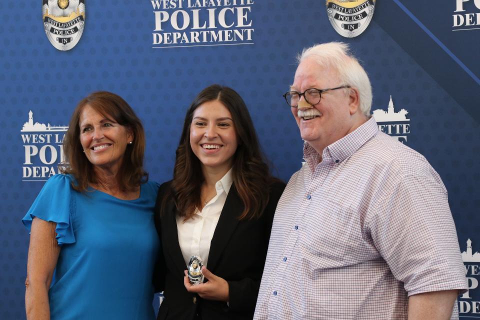 West Lafayette Police Department's newest Officer Aksana Allen poses for a photo with her family after her swearing-in ceremony, on June 28, 2022, at the West Lafayette City Hall.