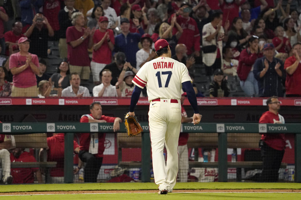 Los Angeles Angels' Shohei Ohtani walks off the field to a standing ovation after the top of the seventh inning of a baseball game against the Oakland Athletics Thursday, Sept. 29, 2022, in Anaheim, Calif. (AP Photo/Mark J. Terrill)