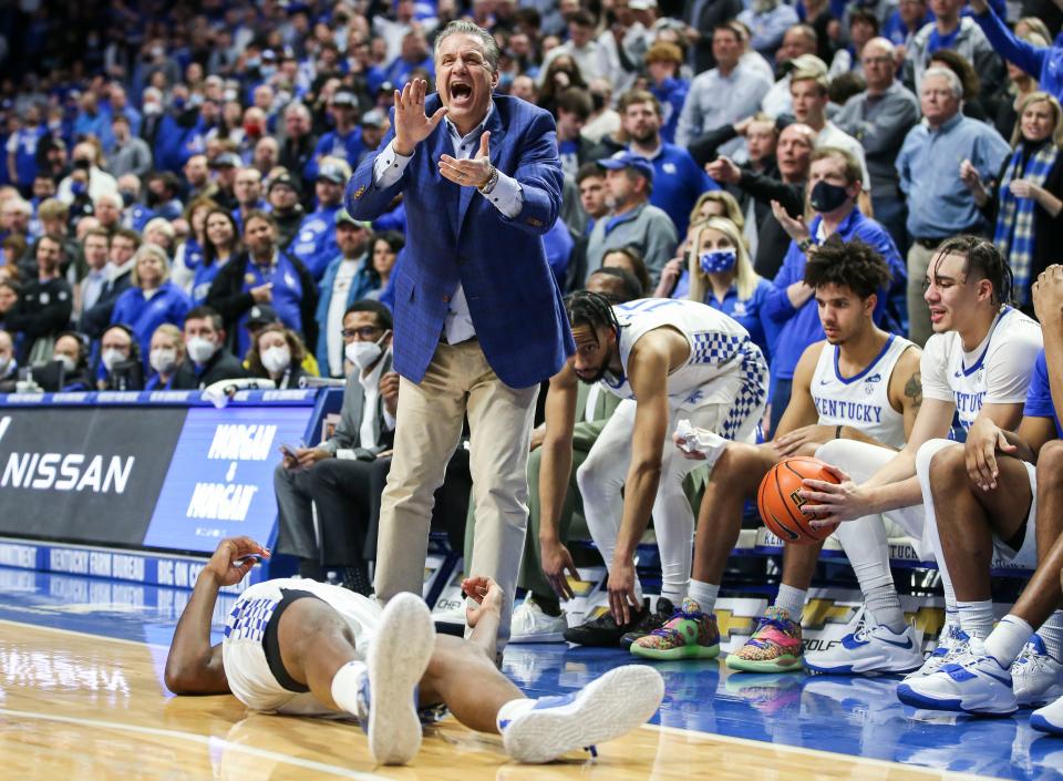 As Kentucky's Oscar Tshiebwe lies on the floor, coach John Calipari laughs sarcastically at the officiating as the Wildcats hold off Mississippi State 82-74 at Rupp Arena Tuesday night. January 25, 2022