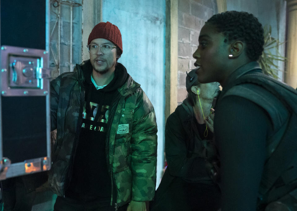 This mage released by MGM shows director Cary Joji Fukunaga, left, with actor Lashana Lynch on the set of the James Bond film "No Time to Die." (Nicola Dove/MGM via AP)