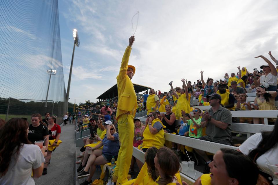 Savannah Bananas owner Jesse Cole tosses beads to the fans during the 2022 Fan Fest at Grayson Stadium.