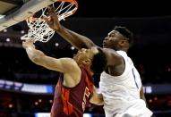 Mar 29, 2019; Washington, DC, USA; Duke Blue Devils forward Zion Williamson (1) blocks a shot by Virginia Tech Hokies guard Justin Robinson (5) during the second half in the semifinals of the east regional of the 2019 NCAA Tournament at Capital One Arena. Mandatory Credit: Geoff Burke-USA TODAY Sports
