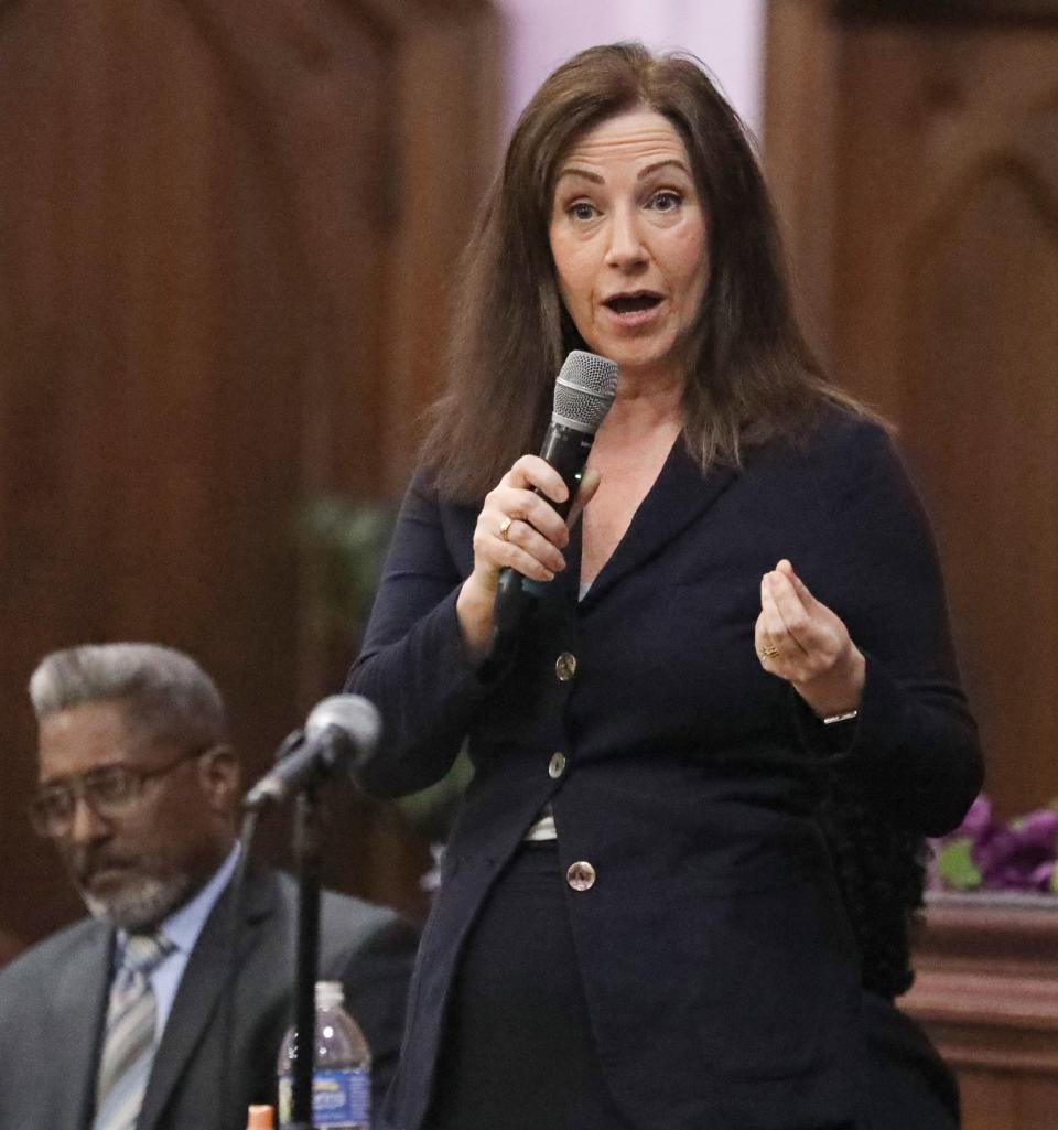 Julie Cianca introduces herself during a Meet the Candidates for Public Defender meeting held Monday, April 18, 2022, at Central Church of Christ in Rochester.