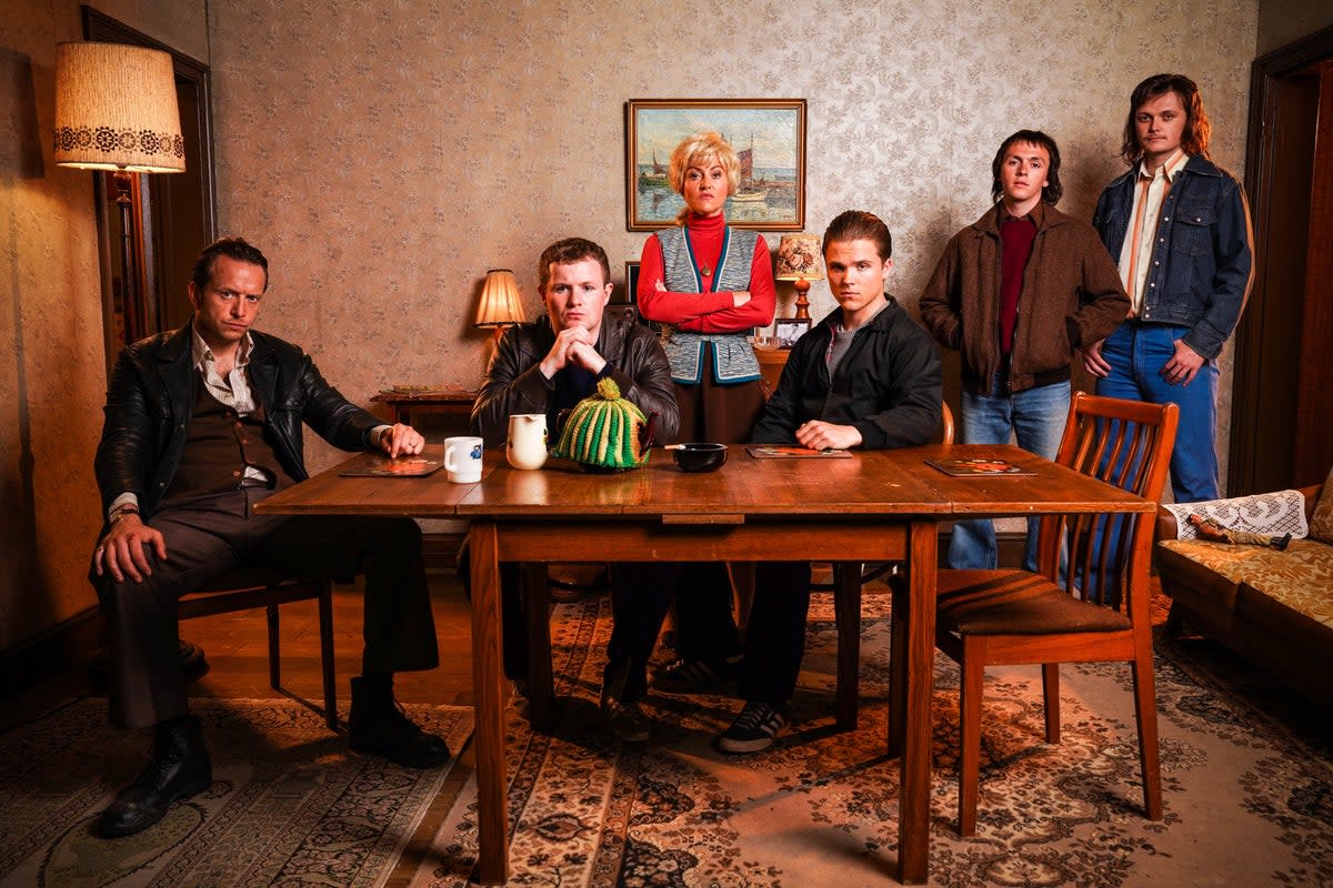 First glimpse of the Mitchell family in EastEnders’s flashback episode, featuring Eric Mitchell, Phil, Peggy, Grant, Billy and Charlie  (BBC/Jack Barnes/Kieron McCarron/PA)