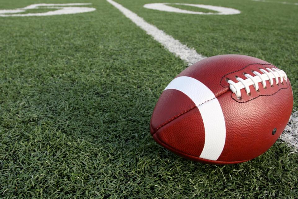 Close-Up Of American Football On Field