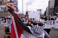 A demonstrator takes part in a protest outside the Federal Building against Israel and in support of Palestinians, Saturday, May 15, 2021 in the Westwood section of Los Angeles. (AP Photo/Ringo H.W. Chiu)