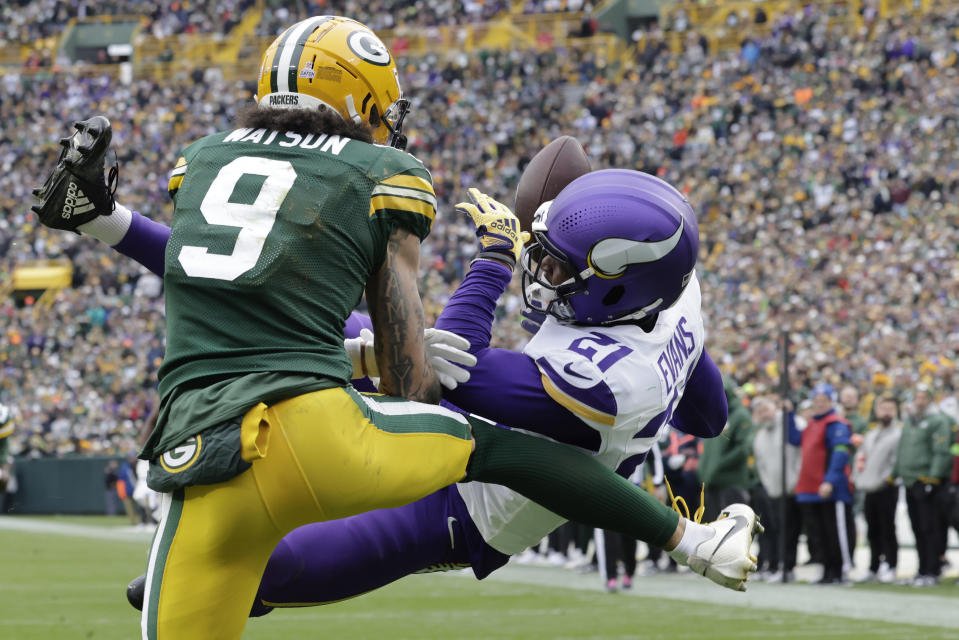 Minnesota Vikings cornerback Akayleb Evans (21) breaks up a pass intended for Green Bay Packers wide receiver Christian Watson (9) during the second half of an NFL football game Sunday, Oct. 29, 2023, in Green Bay, Wis. (AP Photo/Mike Roemer)