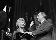 <p>William Saxbe takes the oath of as he is sworn in as the nation’s 78th attorney general in Washington on Friday, Jan. 4, 1974. His wife, Ardath, takes part in the ceremony. Saxbe replaced Elliot Richardson, who resigned in the wake of the firing of Archibald Cox. (Photo: Henry Burroughs/AP) </p>