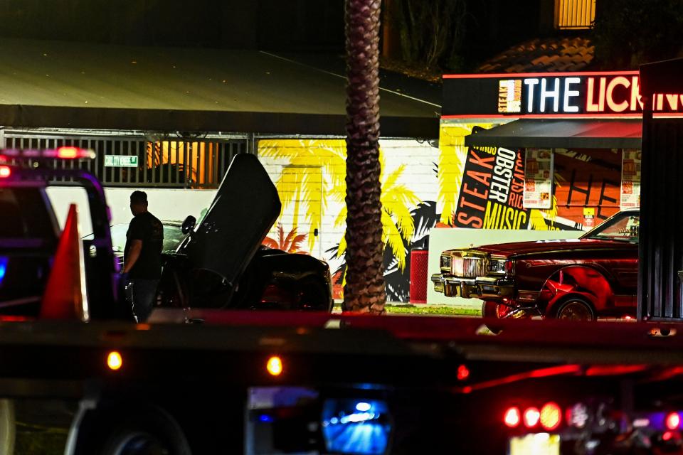 Bullet holes and broken glass are seen on a car being towed from the restaurant "The Licking" where a shooting investigation is being held in Miami Gardens, Florida, Miami, on January 5, 2023. - Multiple people were shot Thursday night outside of a Miami Gardens restaurant during a video shoot for rappers French Montana and Rob49. (Photo by CHANDAN KHANNA / AFP) (Photo by CHANDAN KHANNA/AFP via Getty Images) ORIG FILE ID: AFP_336K8KA.jpg