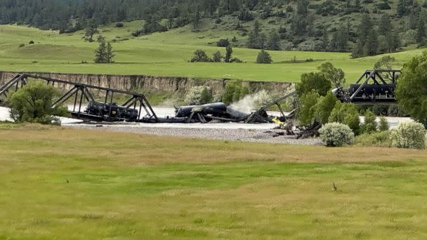 PHOTO: Several train cars are immersed in the Yellowstone River after a bridge collapse near Columbus, Mont., on June 24, 2023. (Yellowstone County Sheriff&#39;s Office)