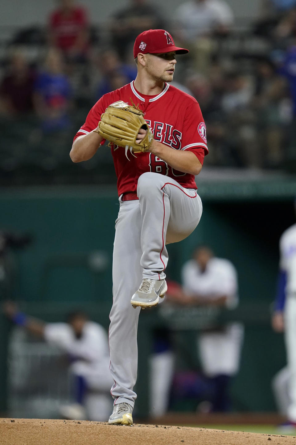 Los Angeles Angels starting pitcher Janson Junk winds up to deliver to the Texas Rangers in the first inning of a baseball game in Arlington, Texas, Wednesday, Sept. 29, 2021. (AP Photo/Tony Gutierrez)