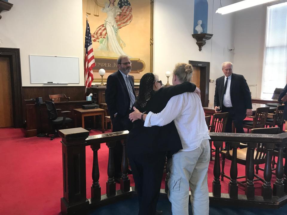 Fredericka Wagner embraces her daughter, Robin, in Pike County Court after charges against her were dismissed in 2019.