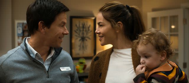 <p>Courtesy of Apple</p> Mark Wahlberg (left) and Michelle Monaghan in 'The Family Plan'