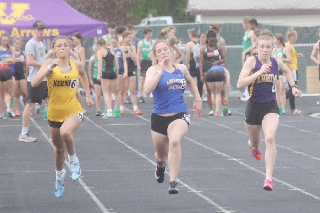 Watertown's Anna Hirtz (right) heads to the finish line along with Mitchell and Aberdeen Central runners during a heat of the girls' 100-meter dash Thursday in the Mark Wendelgass Relays track and field meet at Huron.