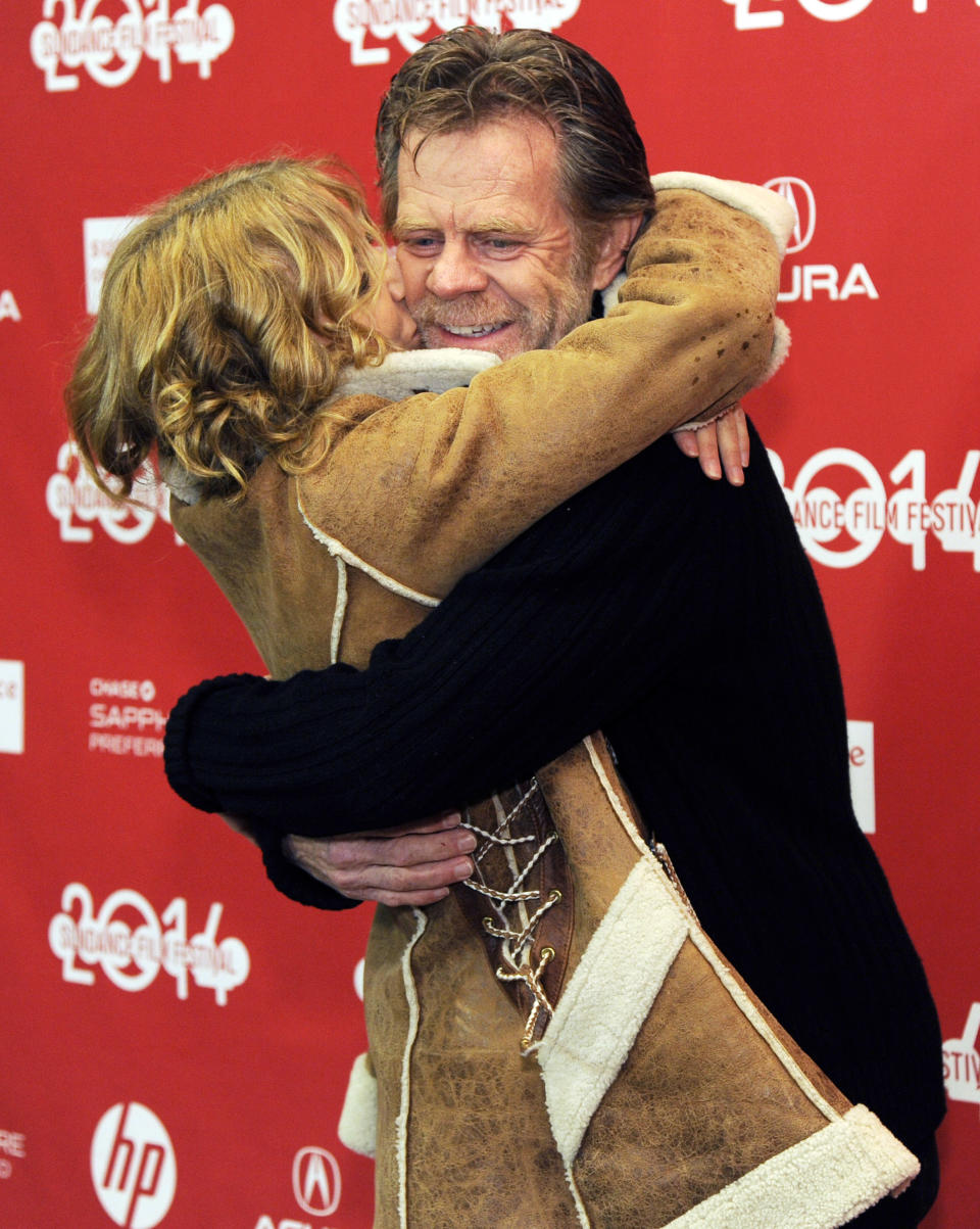 William H. Macy, right, writer/director/cast member of "Ruddlerless," gets a hug from his wife, cast member Felicity Huffman, at the premiere of the film at the 2014 Sundance Film Festival, on Friday, Jan. 24, 2014, in Park City, Utah. (Photo by Chris Pizzello/Invision/AP)