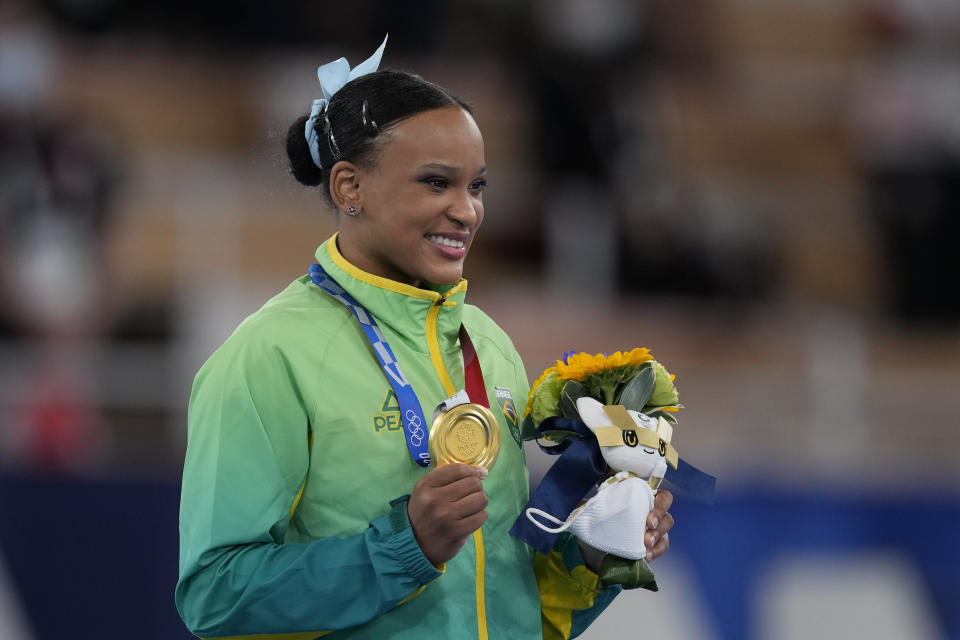 Rebeca Andrade of Brazil, poses after winning the gold medal in vault during the artistic gymnastics women's apparatus final at the 2020 Summer Olympics, Sunday, Aug. 1, 2021, in Tokyo, Japan. (AP Photo/Ashley Landis)