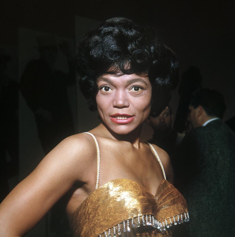 Eartha Kitt poses in a gold dress in a photo taken in the '60s