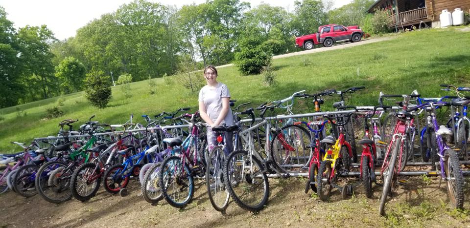 16-year-old Madisyn Kaijala repaired 60 children's bikes, raised $700 to purchase bike helmets of all sizes and a shelter tent to store the bikes in the winter for Camp Putnam in New Braintree.