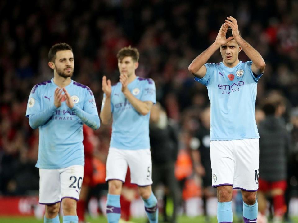 Manchester City's Rodri and Bernardo Silva applaud the fans after the match: Action Images via Reuters