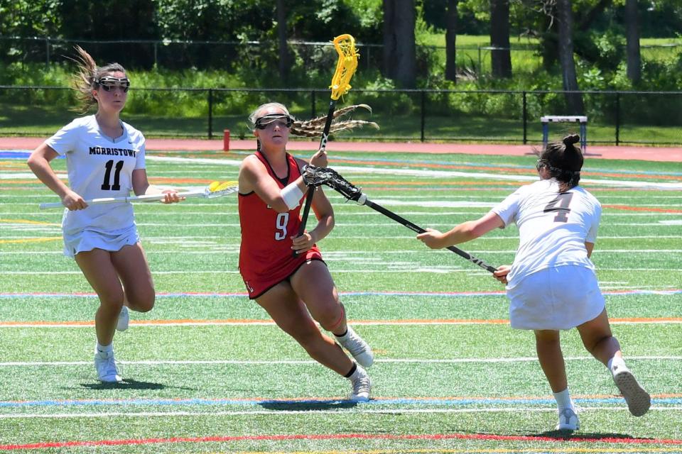 Lenape senior Gianna Monaco split Morristown sophomore Anna Rivetti and senior Elizabeth Rivetti at the 2022 NJSIAA Group 4 girls lacrosse championship at Warren Hills High School