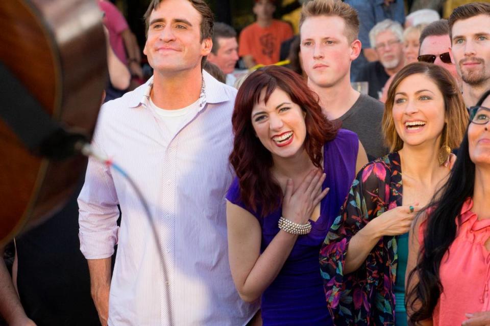 Actors Jason Kuykendall, left, Lyndsy Kail, center, and Dana Brooke, all veterans of B Street Theatre, watch a concert performance during a scene from “Not Your Year,” which was filmed in the Sacramento region in 2015.