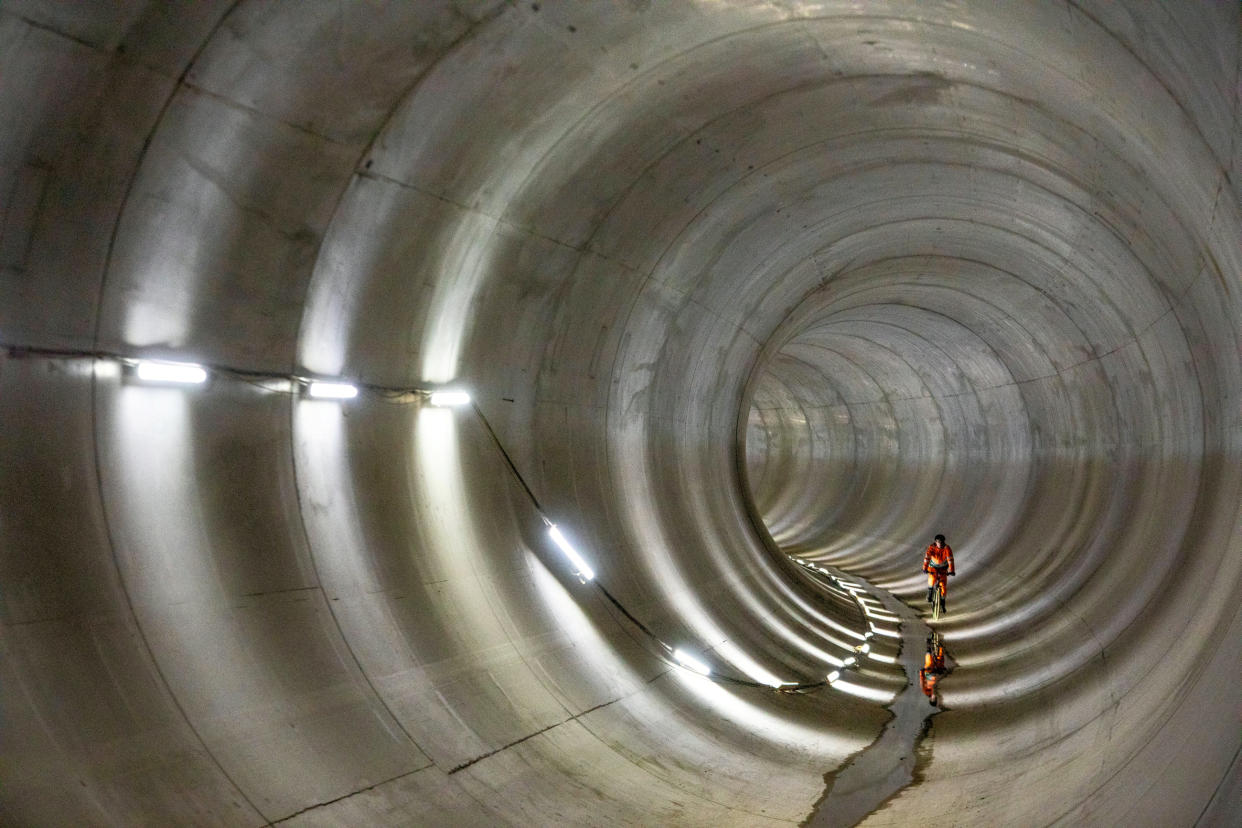 Cyclists who won the chance to cycle through a new super sewer, under the streets of London. February 10, 2023.  Lucky cyclists have braved the depths of London to ride from Battersea to Blackfriars inside a 4.5km super sewer.  See SWNS story SWNAtunnel.  The tunnel is between 40 to 50 metres underground, making it twice as deep as the deepest tube lines in London.  The construction of the sewer began in 2016 and is set to be completed in 2025.  When finished, the super sewer will remove 95 per cent of around 40 million tonnes of raw, untreated sewage that currently spills into the river Thames every year.  The new system will provide a cleaner environment for wildlife and recreational river users.  Employees working on the project at Tideway London were offered the opportunity to buy raffle tickets to win the chance to take their bikes down into the depths.  In total, 360 raffle tickets were bought, raising Â£1535 for charity.  The lucky group made their descent underground in Battersea on 10 February. 