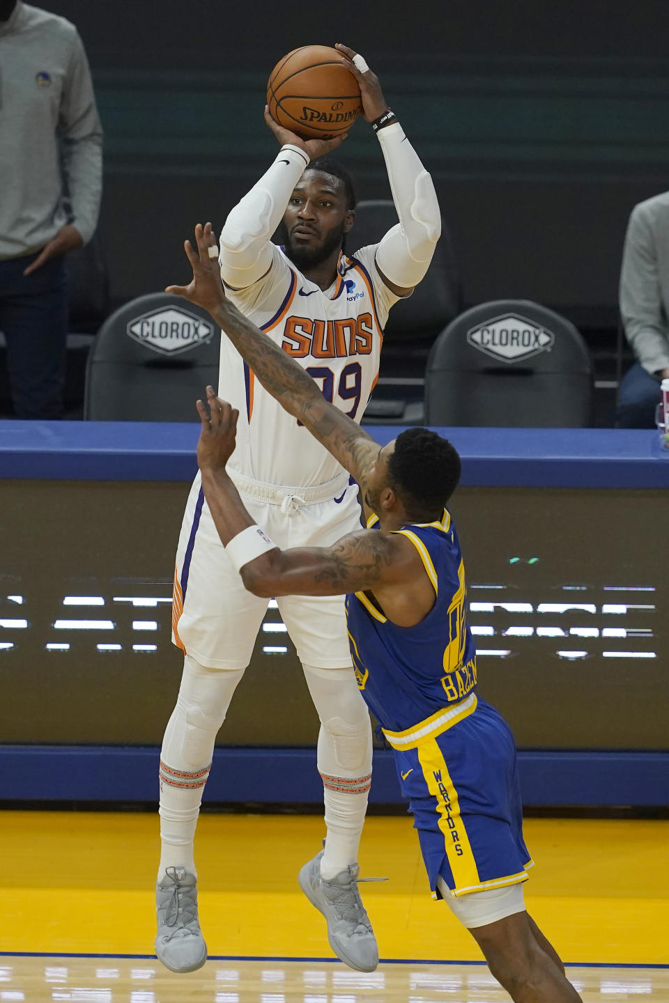 Phoenix Suns forward Jae Crowder, top, shoots a 3-point basket over Golden State Warriors forward Kent Bazemore during the first half of an NBA basketball game in San Francisco, Tuesday, May 11, 2021. (AP Photo/Jeff Chiu)