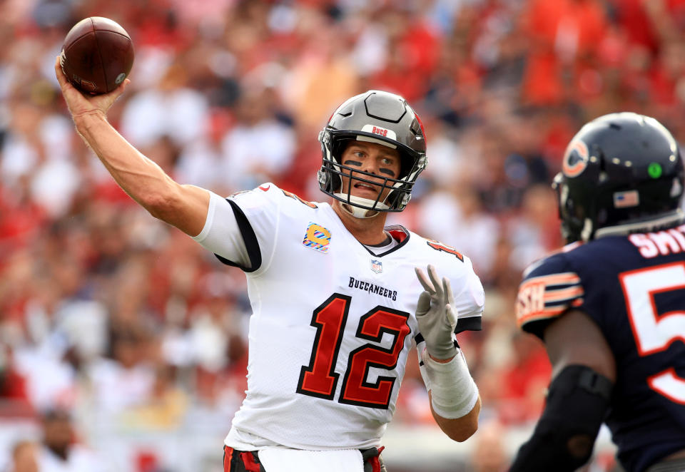 Tom Brady could have been throwing for the Chicago Bears instead of running from them. (File photo by Mike Ehrmann/Getty Images)