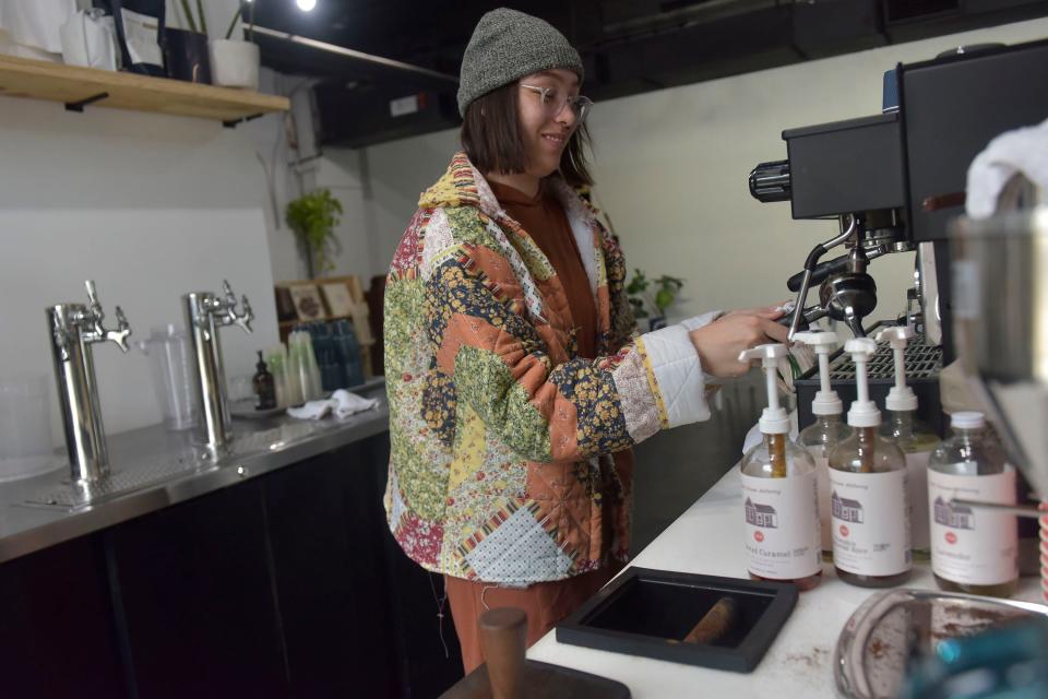 Tatum Hackler, a barista at Easy Going Gallery on North V Street, cleans up her workstation Monday after the mid-day service. Emerald Coast Utilities Authority is undertaking a project to switch many of the homes and businesses in Brownsville from septic tanks to a central sewer system.