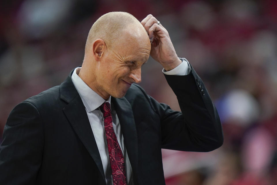 Louisville head coach Chris Mack reacts to a play during the first half of an NCAA college basketball game against Virginia Tech, Sunday, March 1, 2020, in Louisville, Ky. (AP Photo/Bryan Woolston)