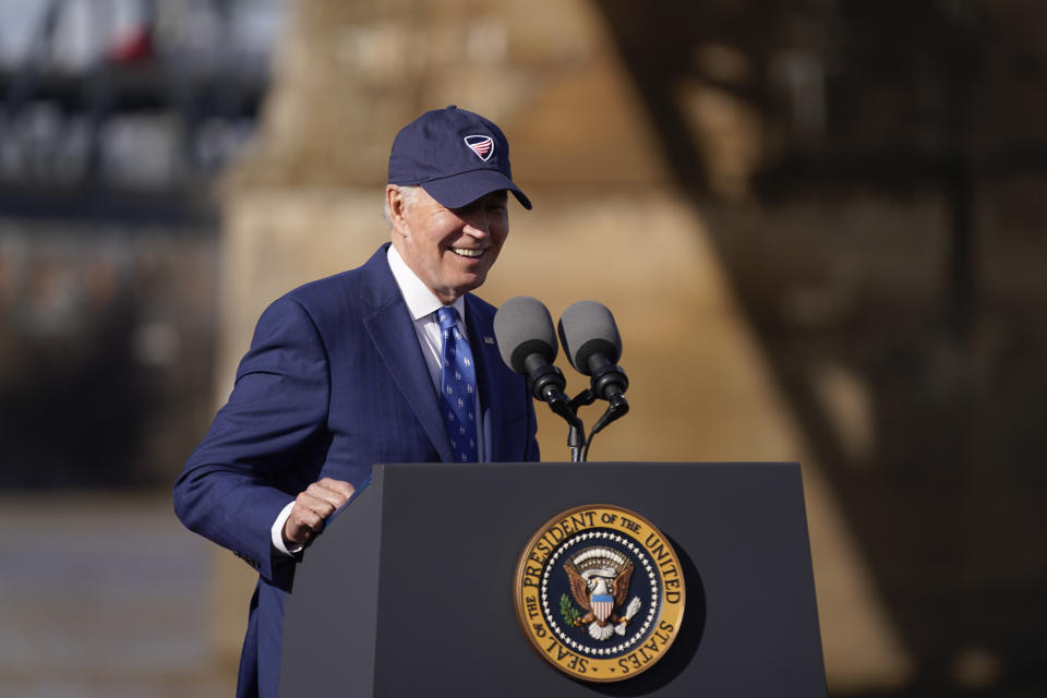 President Joe Biden speaks about his infrastructure agenda under the Clay Wade Bailey Bridge, Wednesday, Jan. 4, 2023, in Covington, Ky. Biden's infrastructure deal that was enacted in late 2021 will offer federal grants to Ohio and Kentucky to build a companion bridge that is intended to alleviate traffic on the Brent Spence Bridge, in background at left. (AP Photo/Patrick Semansky)