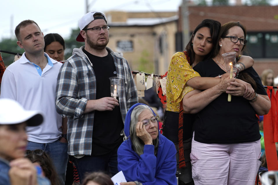 Residents from around the Highland Park, Ill., area listen during a vigil in Highwood, Ill., for the victims of Monday's Highland Park Fourth of July parade mass shooting, Wednesday, July 6, 2022. (AP Photo/Charles Rex Arbogast)