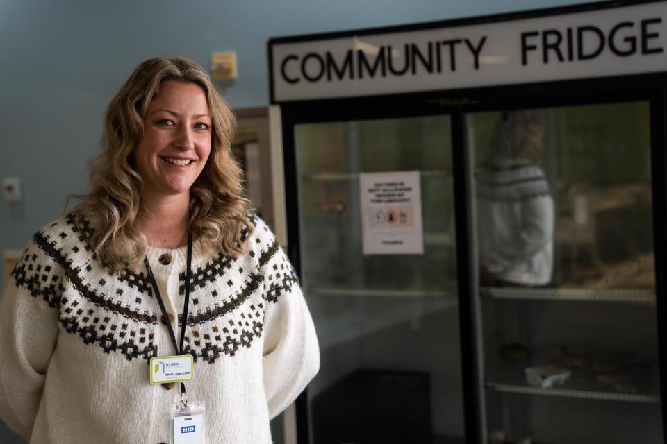 Community Resource Specialist Ashlan Lippert poses for a portrait Monday, Dec. 4, 2023, at Des Moines Public Library's Central Library. Lippert is the library's first social worker and is implementing new programs like community fridge and the growing outreach program.